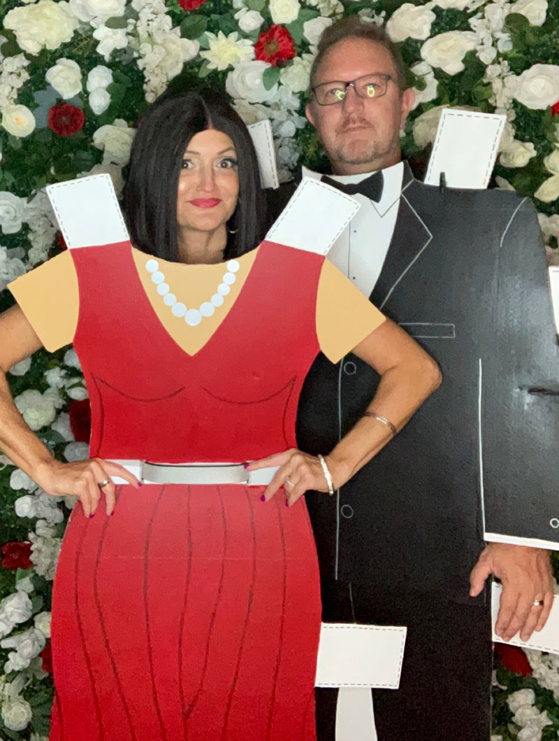 a man and woman dressed in costume as paper dolls