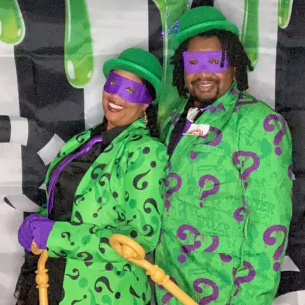Man and woman dressed in matching outfits as The Riddler