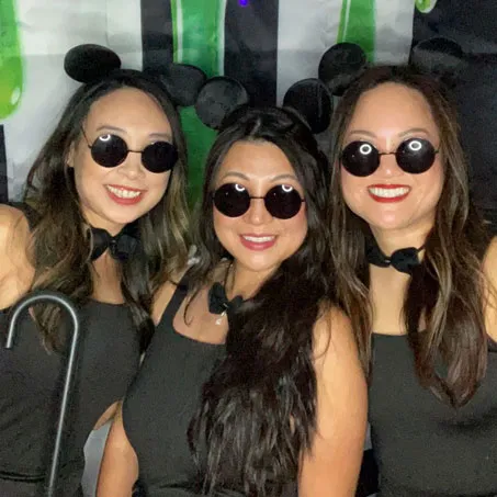 Three young women dressed in costume as the three blind mice